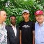 Farmer's son in black with host, the author and economic professor 